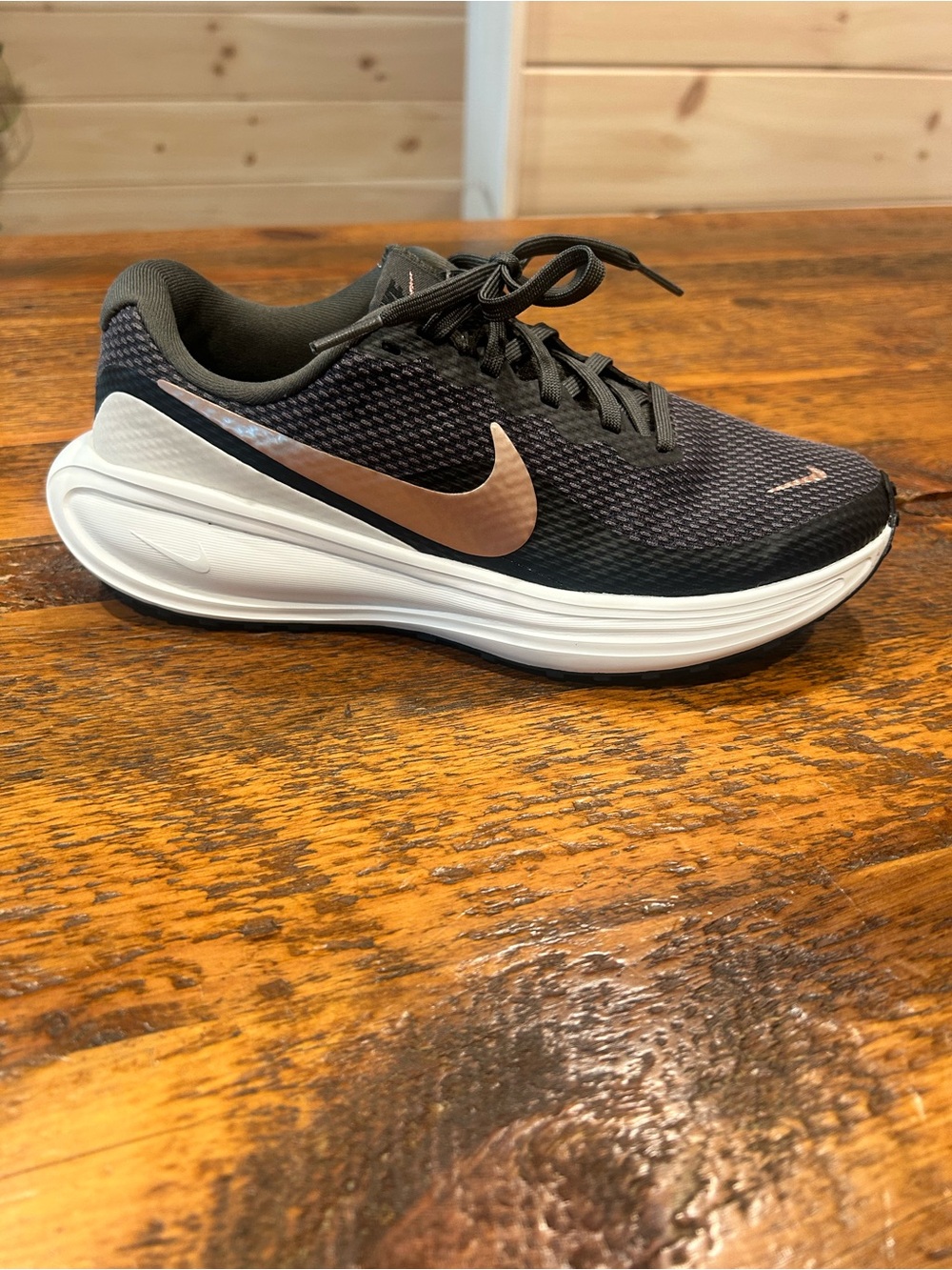 Nike Women’s Revolution 8 with Rose Gold Swoosh. Size 7.5.